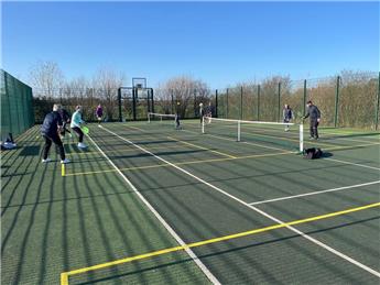 PICKLEBALL GOES OUTDOORS IN SPRING SUNSHINE