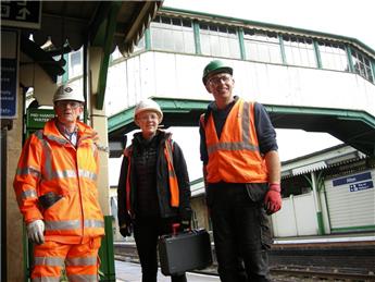 Surveyor inspects inside footbridge