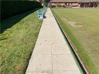 Refurbish concrete slabs around the bowling green
