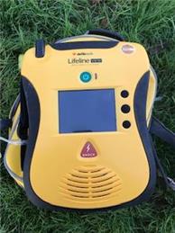 LOST - bright yellow defibrillator - GOAT LEES